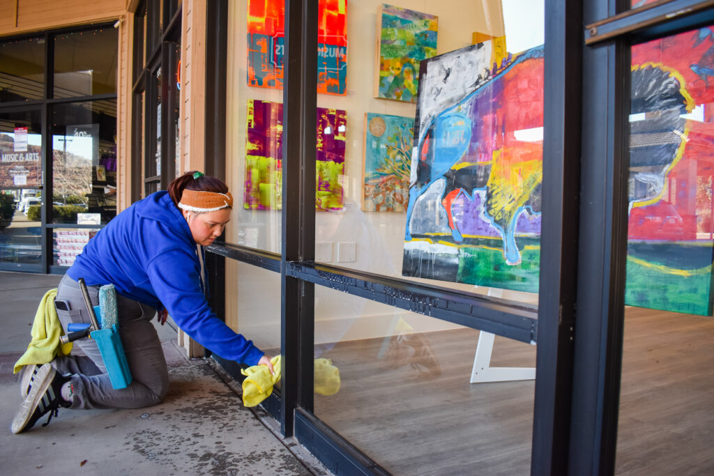 DSS team cleaning Sunset Framer & Gallery Windows